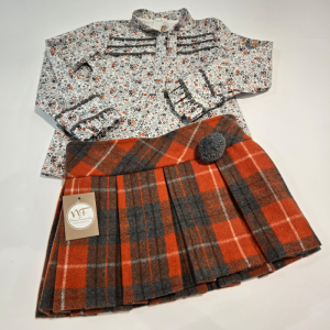 Conjunto blusa falda de tablas tipo short de Noma Fernández